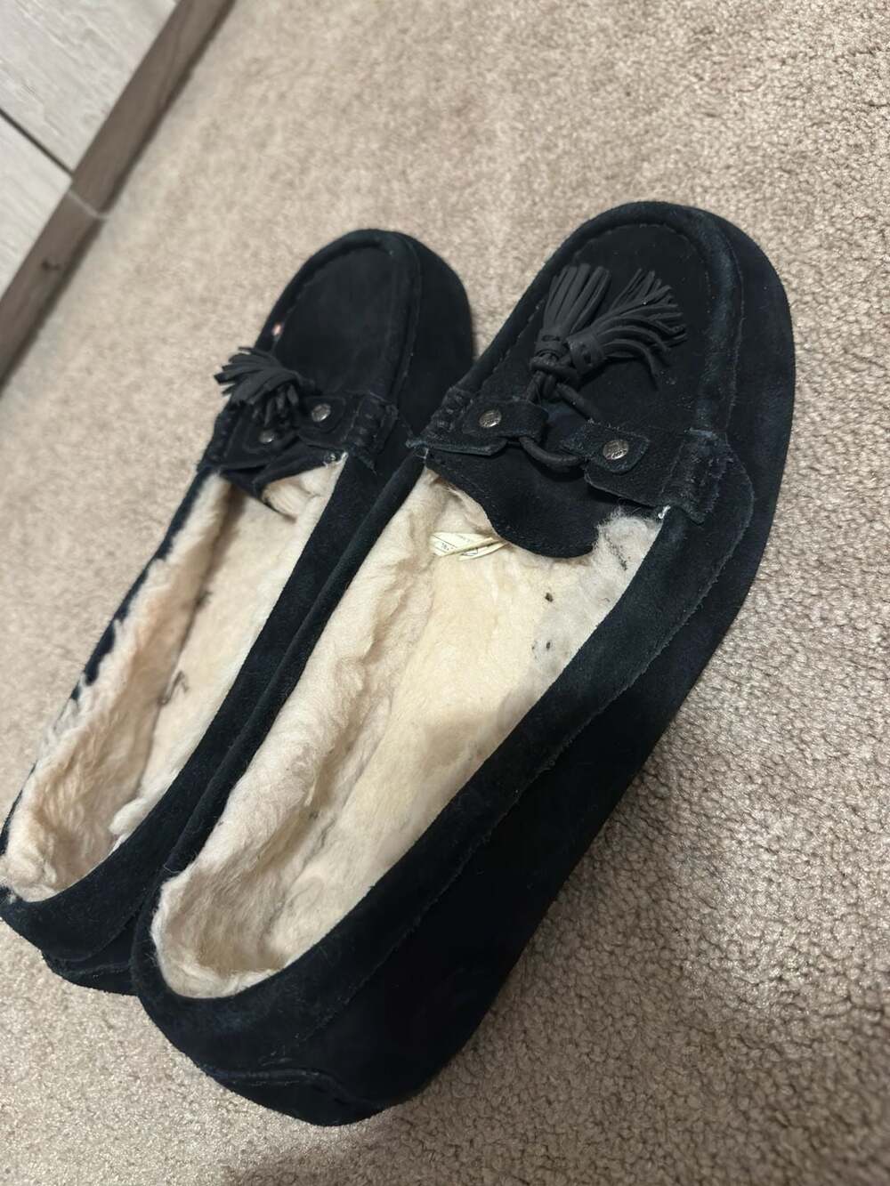 UGG Women's Black Suede Moccasin Slippers with Tassel Detail